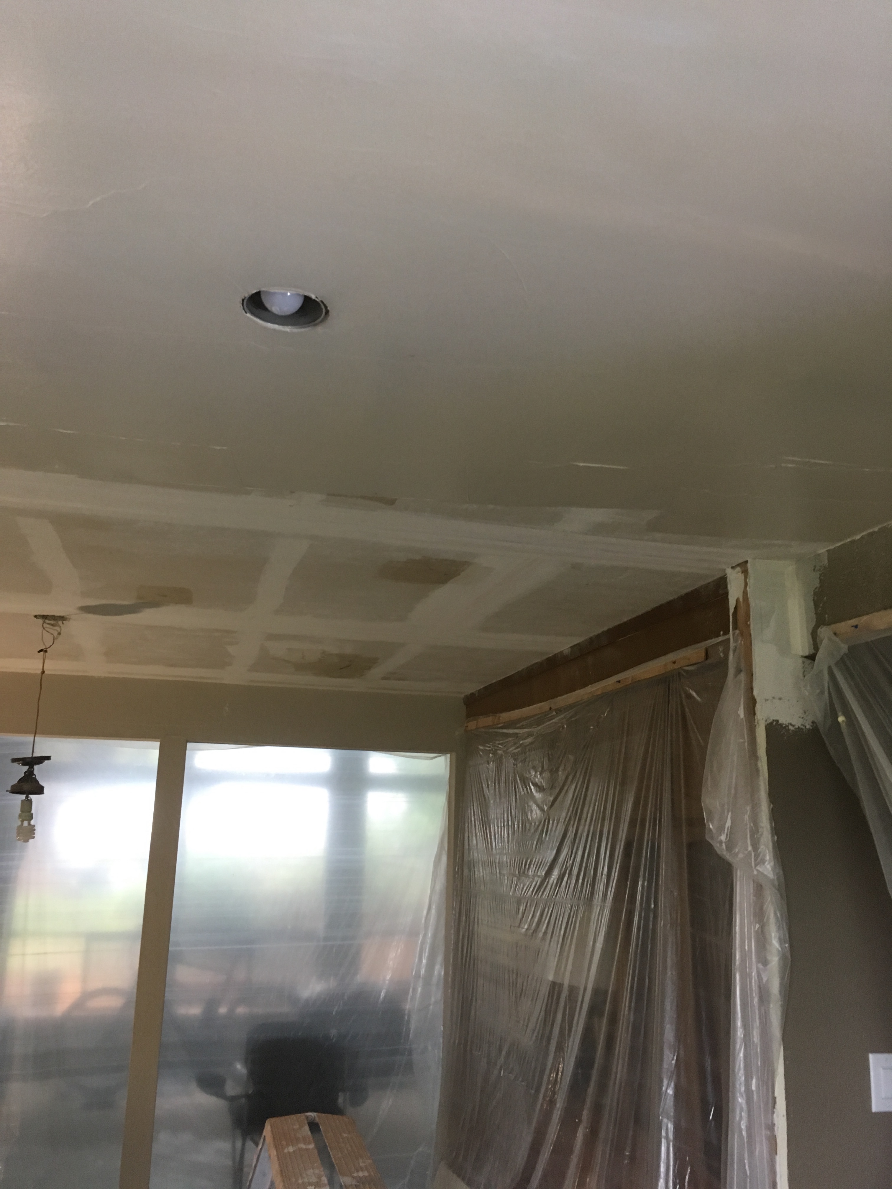 Old ceiling in process of being replaced with new ceiling Old ceiling in process of being replaced with new ceiling